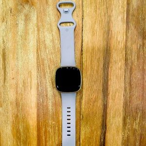 Lavender FitBit Versa 3 smart watch